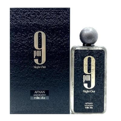 Afnan 9 PM Night Out Extrait de Parfum — A black textured perfume bottle with a dark textured cap stands next to its matching black textured box, both featuring a large white '9 PM Night Out' logo. | Afnan 9 PM Night Out Extrait de Parfum — Botol minyak wangi bertekstur hitam dengan penutup bertekstur gelap berdiri di