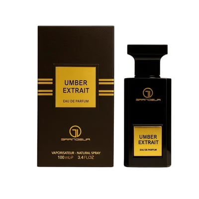 Grandeur Amber Leather 100ml by Grandeur Perfumes — A dark glass perfume bottle with a gold label sits next to its black and gold striped box on a white background. | Grandeur Amber Leather 100ml oleh Grandeur Perfumes — Botol minyak wangi kaca gelap dengan label emas duduk di sebelah kotaknya yang berjalur hitam dan