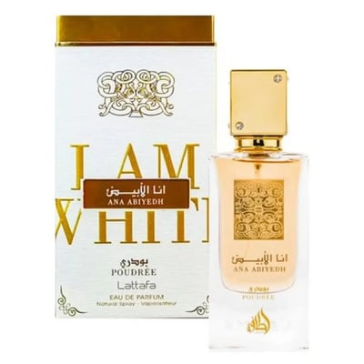 Lattafa Ana Abiyedh Poudree by Lattafa 60ml — A white perfume box with gold accents and Arabic calligraphy stands next to a clear glass perfume bottle with a gold cap and intricate gold detailing on the bottle. | Lattafa Ana Abiyedh Poudree by Lattafa 60ml — Kotak minyak wangi putih dengan aksen emas dan kaligrafi