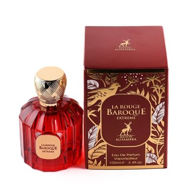 Maison Alhambra Baroque Rouge Extrait 100ml by Maison Alhambra — Red faceted glass perfume bottle with gold cap next to a red and gold ornate box with a bird and deer motif | Maison Alhambra Baroque Rouge Extrait 100ml by Maison Alhambra — Botol kaca merah berfaset dengan penutup emas di sebelah kotak merah dan emas