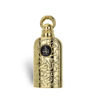 Lattafa Bayaan Eau De Parfum — A gold-colored perfume bottle with ornate Arabic script and a gold ring handle sits next to its matching gold box, also adorned with script and a circular logo. | Lattafa Bayaan Eau De Parfum — Botol minyak wangi berwarna emas dengan skrip Arab berhias dan pemegang cincin emas duduk