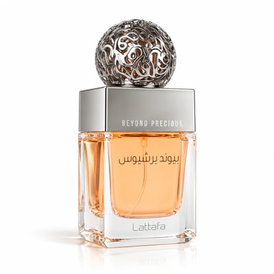 Lattafa Beyond Precious by Lattafa 100ml EDP Women — Botol minyak wangi kaca berbentuk segi empat dengan cecair oren, di atasnya penutup sfera perak berkerawang, terletak bersebelahan kotak berwarna pic dengan penutup berlubang hiasan.