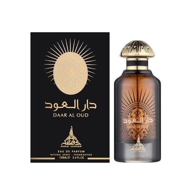Paris Corner Daar Al Oud Intense 100ml — Black box with gold sunburst and Arabic script next to a glass perfume bottle with gold cap and matching design | Paris Corner Daar Al Oud Intense 100ml — Kotak hitam dengan pancaran matahari emas dan tulisan Arab di sebelah botol minyak wangi kaca dengan penutup emas dan reka