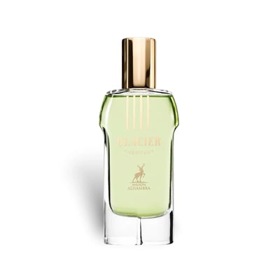 Maison Alhambra Glacier Heaven 100ml — Green floral patterned cylindrical box and a clear glass perfume bottle with green liquid and gold cap, set against a white background. | Maison Alhambra Glacier Heaven 100ml — Kotak silinder hijau bermotif bunga dan botol minyak wangi kaca jernih dengan cecair hijau dan penutup