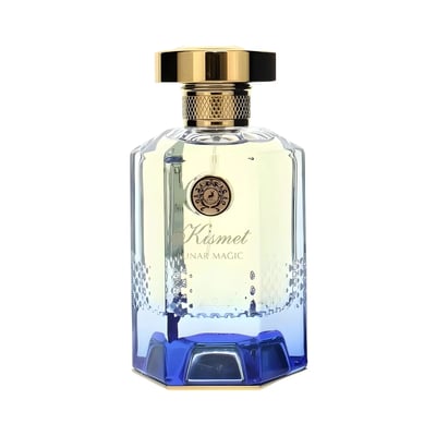 Maison Alhambra Kismet Lunar Magic 100ml — A clear glass perfume bottle with a gold cap and blue gradient base sits next to its matching blue and gold box on a white background. | Maison Alhambra Kismet Lunar Magic 100ml — Botol minyak wangi kaca jernih dengan penutup emas dan tapak gradien biru terletak di sebelah