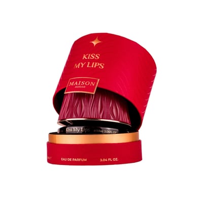 Maison Asrar Kiss My Lips by Maison Asrar 90ml EDP Unisex — Red cylindrical packaging with gold accents, featuring 'KISS MY LIPS' and 'MAISON ASRAR' text. The perfume bottle has a textured, deep red cap and a black base with gold trim, displaying 'Kiss My Lips' and volume details.