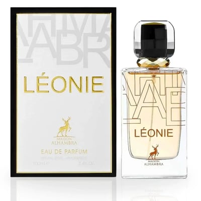 Maison Alhambra Leonie for Women by Maison Alhambra 100ml — A perfume bottle and its box are displayed side-by-side against a white background. The box is black and white with gold lettering and a deer logo. The bottle is clear glass with gold lettering and a deer logo. | Maison Alhambra Leonie for Women by Maison