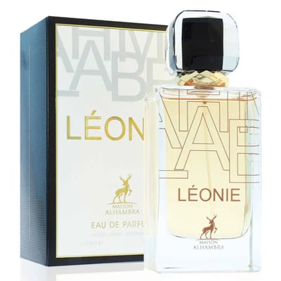 Maison Alhambra Leonie for Women by Maison Alhambra 100ml — A perfume bottle and its box are displayed side-by-side against a white background. The box is black and white with gold lettering and a deer logo. The bottle is clear glass with gold lettering and a deer logo. | Maison Alhambra Leonie for Women by Maison
