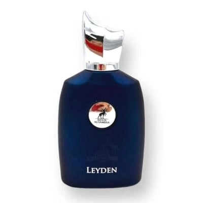 Maison Alhambra Leyden Eau De Parfum — A dark blue perfume bottle and its matching striped box are displayed side-by-side against a white background. The box features two white horses and a circular emblem. | Maison Alhambra Leyden Eau De Parfum — Botol minyak wangi biru gelap dan kotaknya yang berjalur dipamerkan