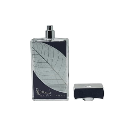 Lattafa Najdia Intense Men Lattafa 100ml EDP — A clear glass perfume bottle with a grey cap and a prominent silver leaf design on the front, placed next to its matching grey and blue box with a similar silver leaf motif.