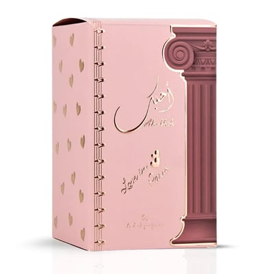 Ard Al Zaafaran Ahubbak Love In Paris EDP 100ml Zaafaran — Pink perfume bottle with a decorative column motif and gold accents, featuring Arabic script and "Love in Paris" text.