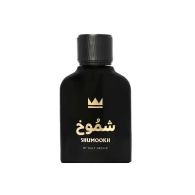 Gulf Orchid Shumookh Parfum 100ml Gulf Orchid — Black perfume bottle and its black and white patterned box with gold crown and Arabic text | Gulf Orchid Shumookh Parfum 100ml Gulf Orchid — Botol minyak wangi hitam dan kotaknya yang bercorak hitam putih dengan mahkota emas dan teks Arab
