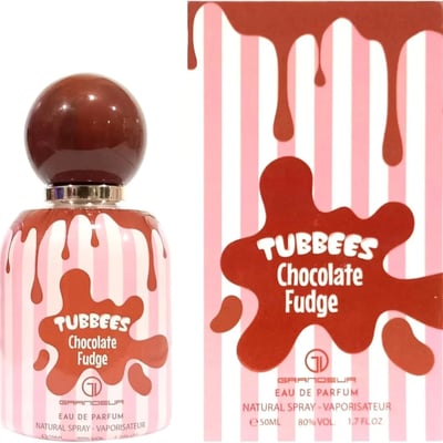 Grandeur Tubbees Chocolate Fudge — A perfume bottle with a chocolate-colored spherical cap and pink and white striped body, with chocolate drips cascading down. Next to it is the product box with the same design. | Grandeur Tubbees Chocolate Fudge — Botol minyak wangi dengan penutup bulat berwarna coklat dan badan