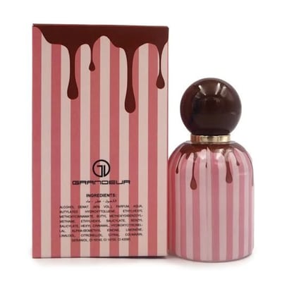 Grandeur Tubbees Chocolate Fudge — A perfume bottle with a chocolate-colored spherical cap and pink and white striped body, with chocolate drips cascading down. Next to it is the product box with the same design. | Grandeur Tubbees Chocolate Fudge — Botol minyak wangi dengan penutup bulat berwarna coklat dan badan