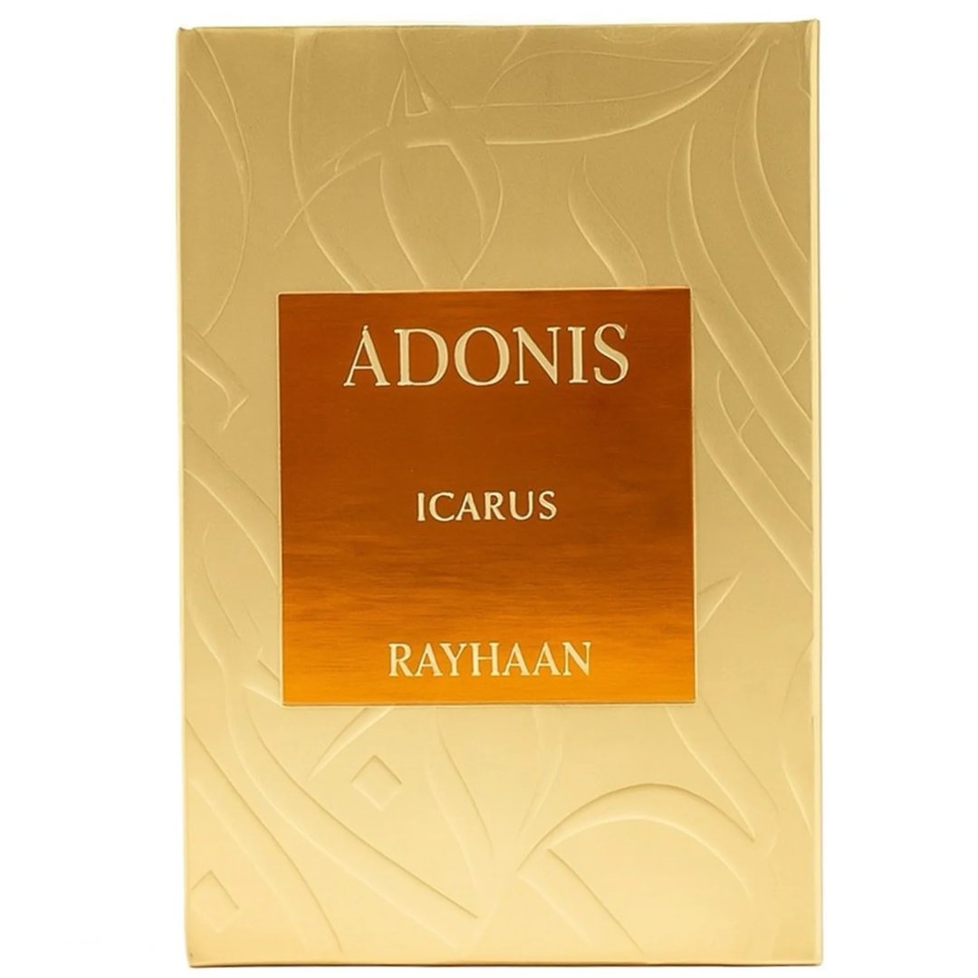 Rayhaan Adonis Icarus Perfume — A gold embossed box sits next to a square amber glass perfume bottle with a gold cap, both featuring intricate embossed patterns. | Rayhaan Adonis Icarus Perfume — Kotak emas bertekstur duduk bersebelahan botol minyak wangi kaca berwarna ambar berbentuk segi empat dengan penutup emas