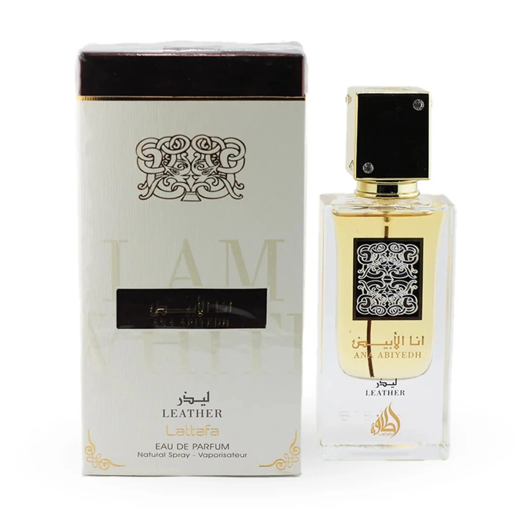 Lattafa Ana Abiyedh Leather 60ml by Lattafa Perfumes — A white perfume box with gold Arabic calligraphy and a clear glass bottle with gold accents and a dark brown cap, displayed side-by-side. | Lattafa Ana Abiyedh Leather 60ml by Lattafa Perfumes — Kotak minyak wangi putih dengan kaligrafi Arab emas dan botol kaca
