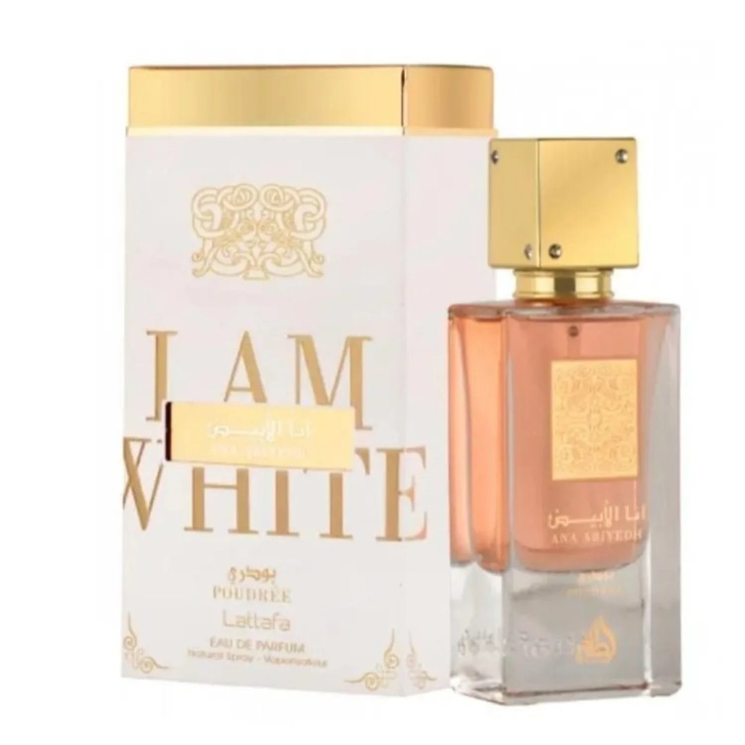 Lattafa Ana Abiyedh Poudree by Lattafa 60ml — A white perfume box with gold accents and Arabic calligraphy stands next to a clear glass perfume bottle with a gold cap and intricate gold detailing on the bottle. | Lattafa Ana Abiyedh Poudree by Lattafa 60ml — Kotak minyak wangi putih dengan aksen emas dan kaligrafi