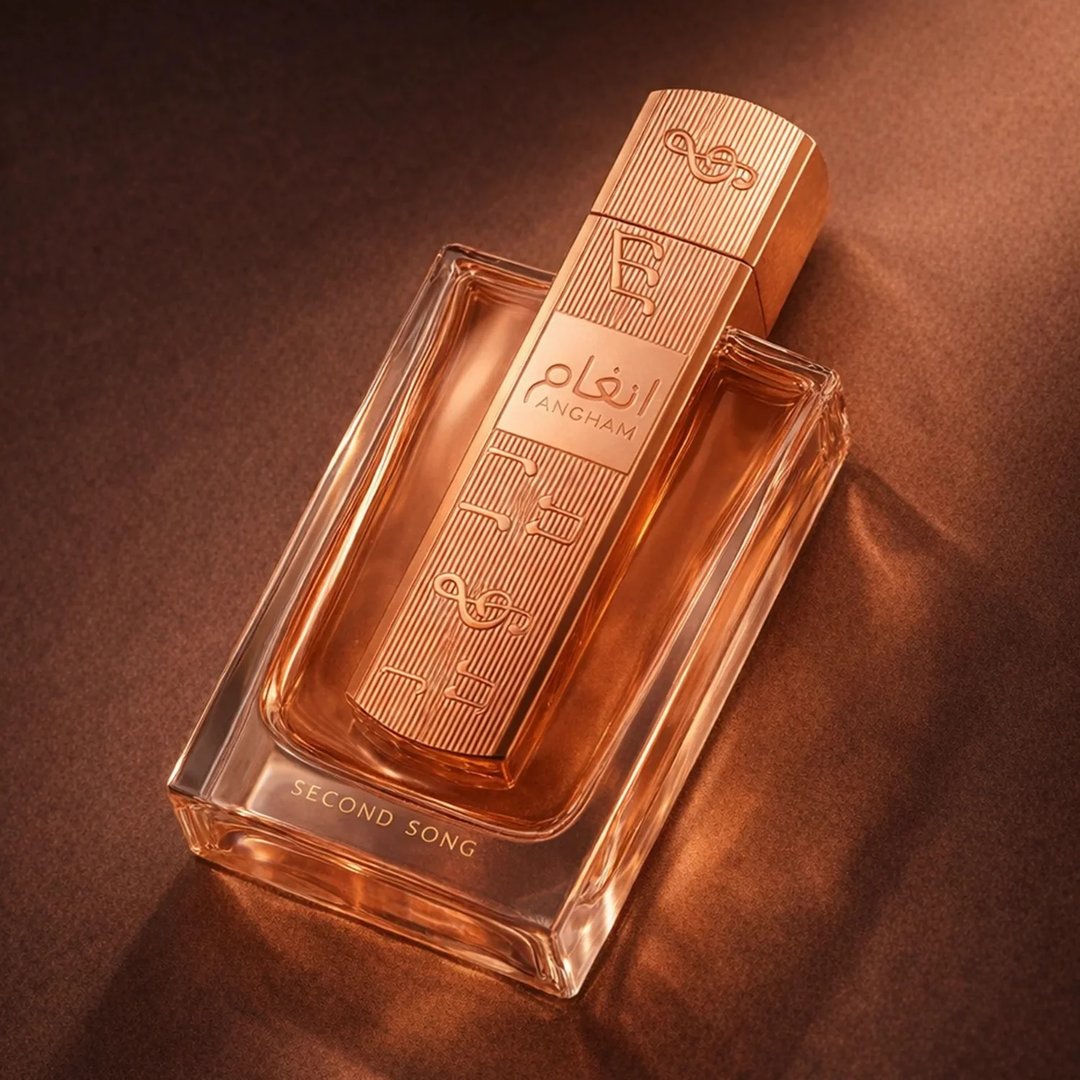 Lattafa Angham Second Song Perfume — Pink box and glass bottle with rose gold cap, featuring musical notes design.