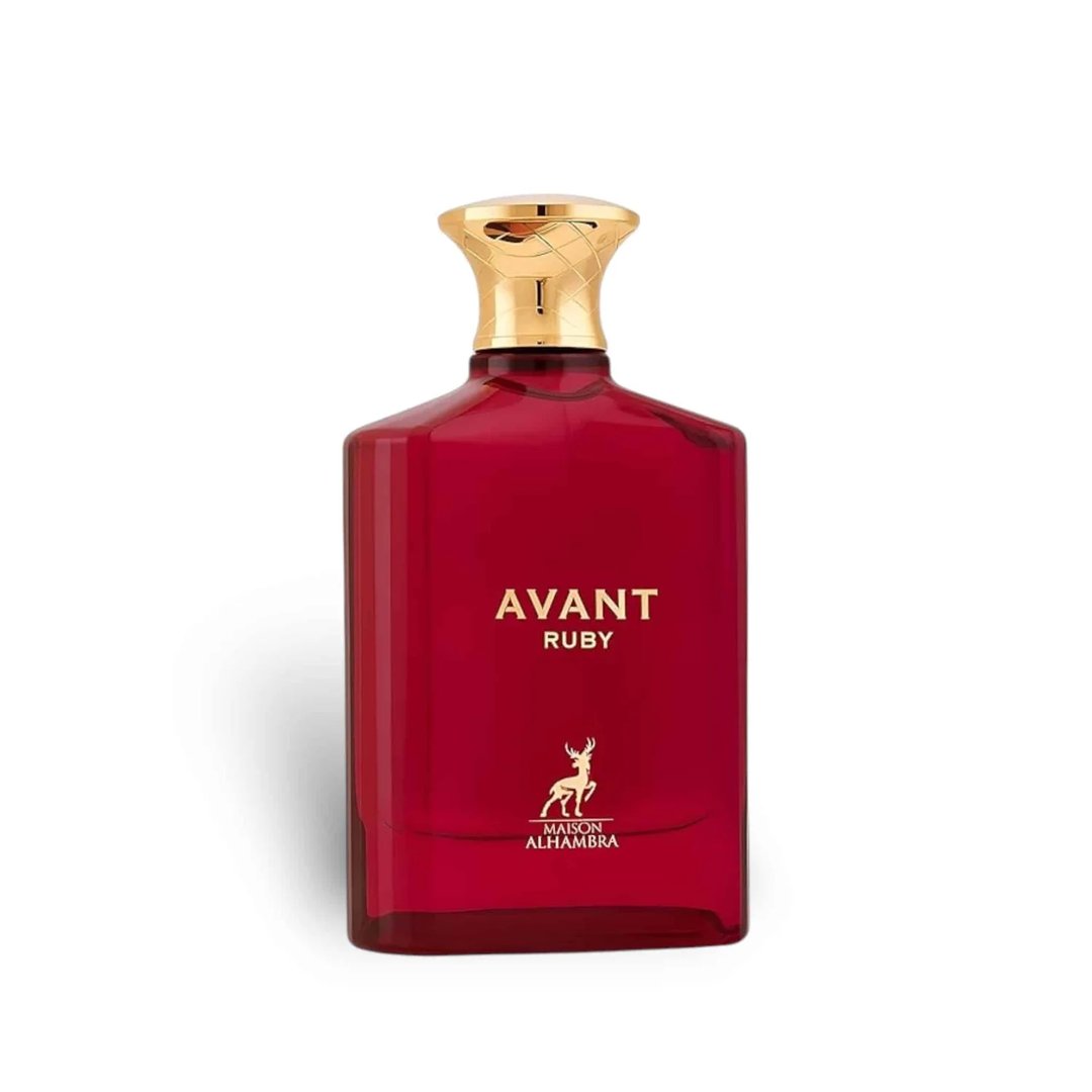 Maison Alhambra Avant Ruby Eau De Parfum 100ml — A bright pink glass perfume bottle with a gold textured cap stands next to its white and gold patterned box, both featuring the Avant Ruby branding and a deer logo. | Maison Alhambra Avant Ruby Eau De Parfum 100ml — Botol kaca berwarna merah jambu terang dengan penutup