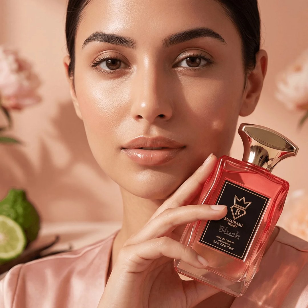 Bujairami Blush Eau de Parfum — Red box and glass bottle with gold cap and red liquid, black label with gold crown and B logo