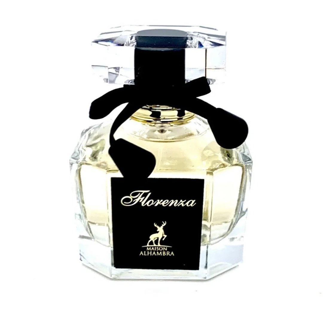 Maison Alhambra Florenza 100ml Maison Alhambra Florence — A perfume bottle and its box are displayed against a white background. The box has a floral design and the bottle is octagonal with a black ribbon. | Maison Alhambra Florenza 100ml Maison Alhambra Florence — Botol minyak wangi dan kotaknya dipamerkan berlatar
