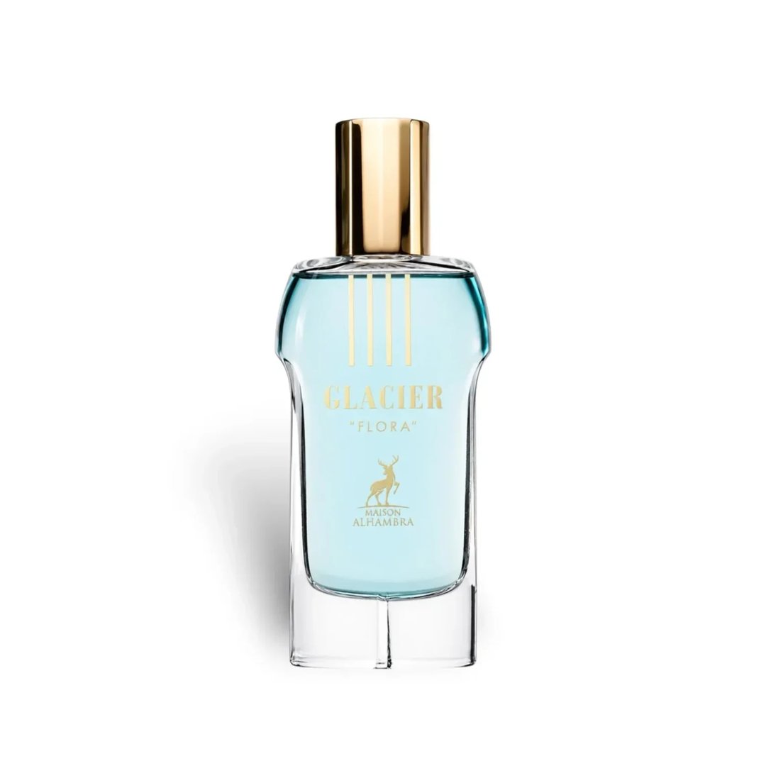 Maison Alhambra Glacier Flora 100ml Maison Alhambra — A blue perfume bottle with a gold cap and vertical gold lines on the glass, stands next to its matching cylindrical blue and gold patterned box on a white background. | Maison Alhambra Glacier Flora 100ml Maison Alhambra — Botol minyak wangi biru dengan penutup
