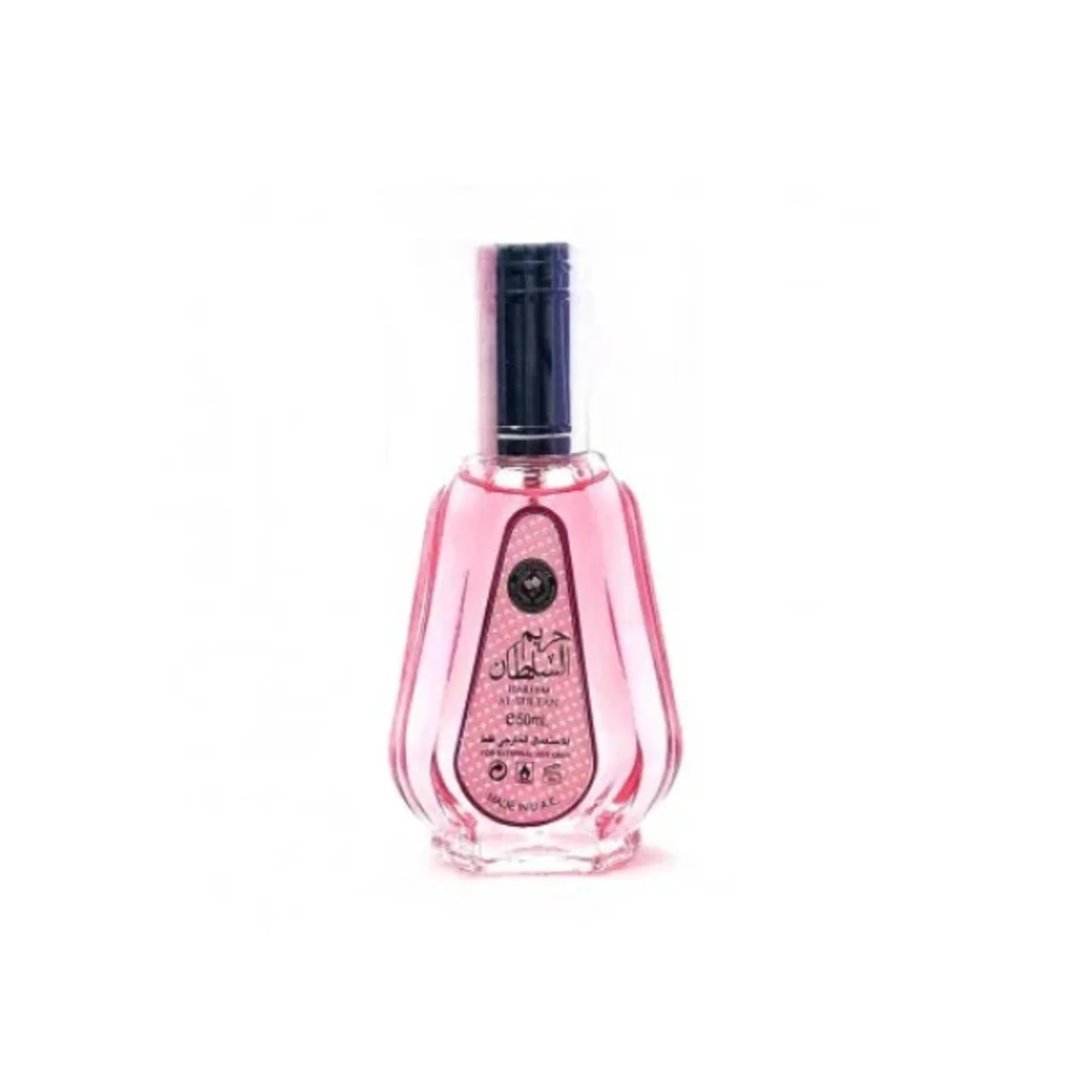 Ard Al Zaafaran Hareem Al Sultan EDP 50ml — A pink perfume bottle with a silver cap and a patterned label sits next to its matching pink and gold patterned box with a circular purple design. | Ard Al Zaafaran Hareem Al Sultan EDP 50ml — Sebotol minyak wangi merah jambu dengan penutup perak dan label bercorak terletak