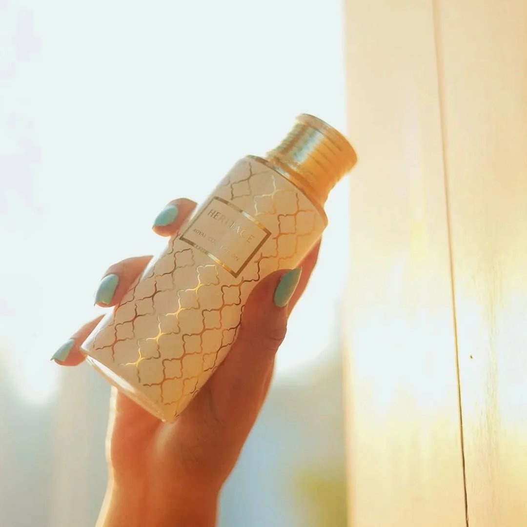 Maison Asrar Heritage by Maison Asrar 100ml EDP Unisex — White bottle with gold geometric pattern and gold fluted cap