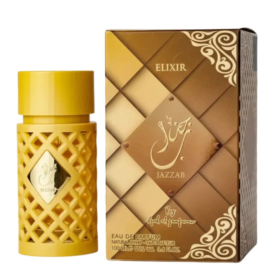 Ard Al Zaafaran Jazzab Gold Eau De Parfum 100ml — A gold-toned perfume bottle with a diamond-patterned cage sits next to its matching patterned box on a white background. | Ard Al Zaafaran Jazzab Gold Eau De Parfum 100ml — Botol minyak wangi berwarna emas dengan sangkar bermotif berlian duduk bersebelahan dengan kotak