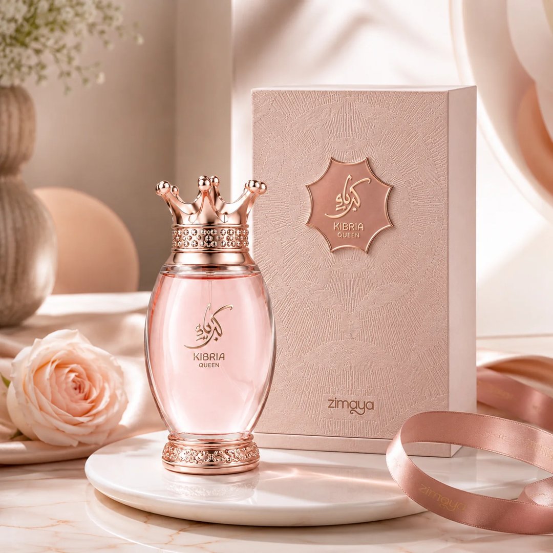 Zimaya Kibria Glory — Rose gold perfume bottle with crown cap and matching textured box, both featuring embossed Arabic script and 'KIBRIA GLORY' text.