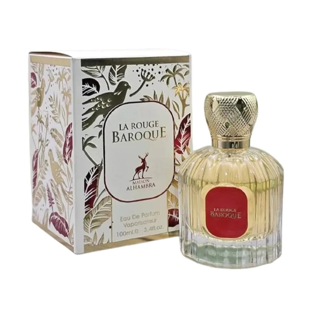 Maison Alhambra La Rouge Baroque 100ml — A perfume bottle with yellow liquid and a red label, next to its decorative box with gold and red leaf patterns and a deer logo. | Maison Alhambra La Rouge Baroque 100ml — Botol minyak wangi dengan cecair kuning dan label merah, bersebelahan dengan kotak hiasannya dengan corak