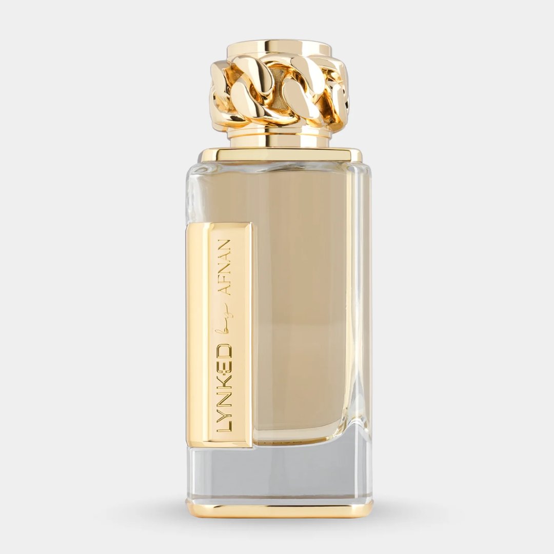 Afnan Lynked Forever by Afnan 100ml Eau De Parfum — A gold-capped perfume bottle stands next to its rose gold box with