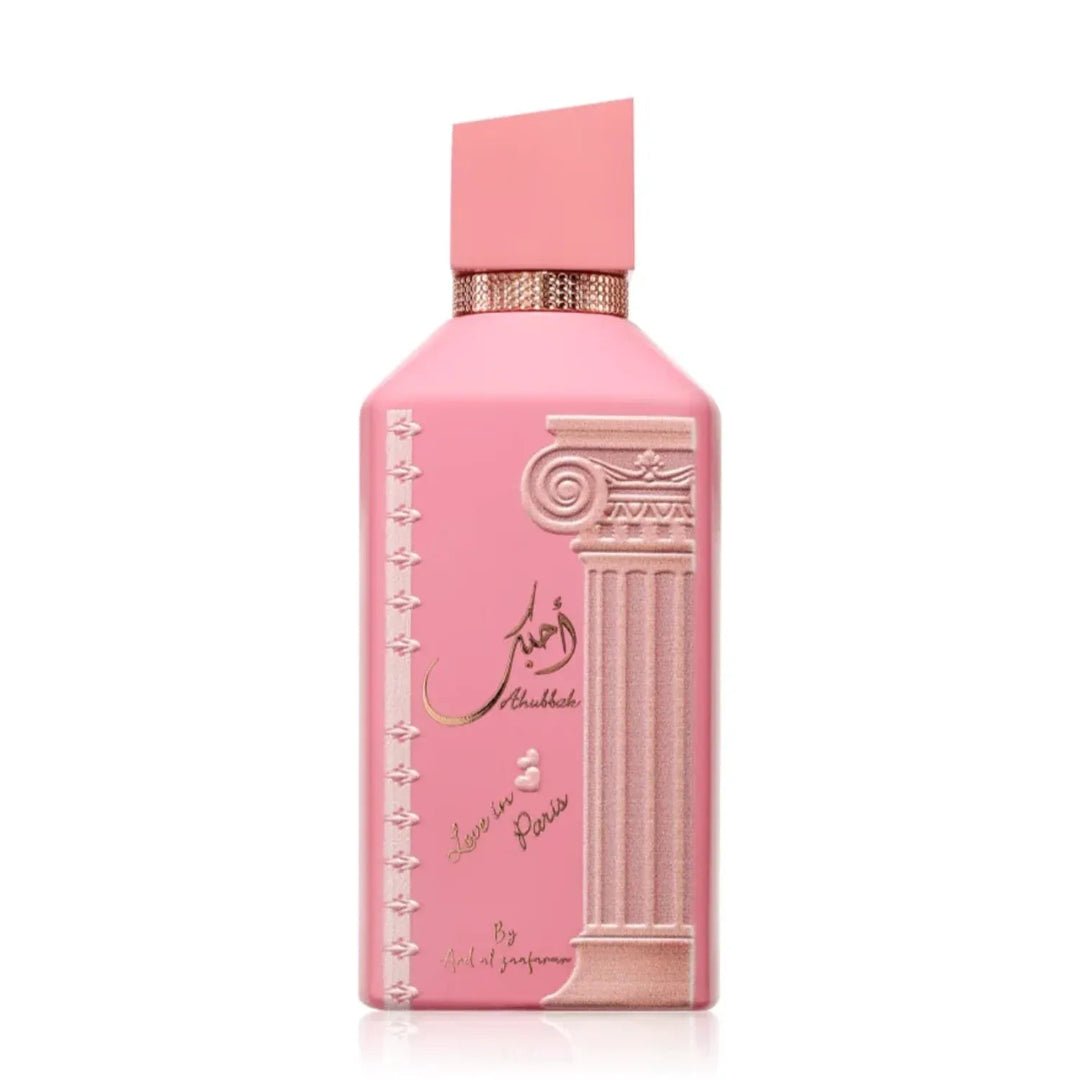 Ard Al Zaafaran Ahubbak Love In Paris EDP 100ml Zaafaran — Pink perfume bottle with a decorative column motif and gold accents, featuring Arabic script and "Love in Paris" text.