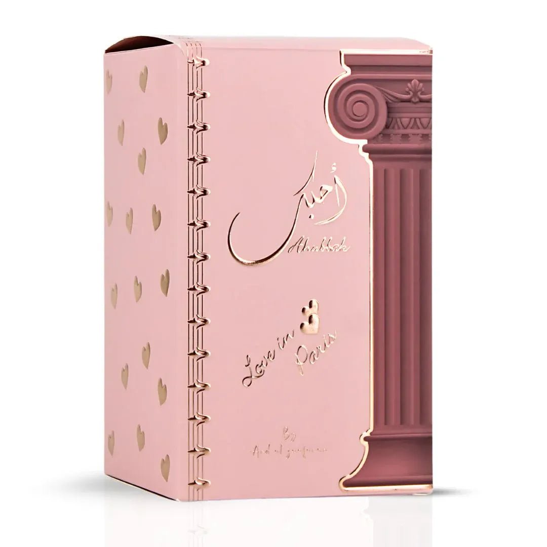 Ard Al Zaafaran Ahubbak Love In Paris EDP 100ml Zaafaran — Pink perfume bottle with a decorative column motif and gold accents, featuring Arabic script and "Love in Paris" text.