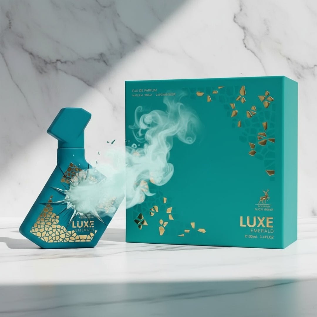 Perfume bottle broken, icy mint fog emerging; studio on white marble Malaysia — clear bottle and box, cinematic lighting.