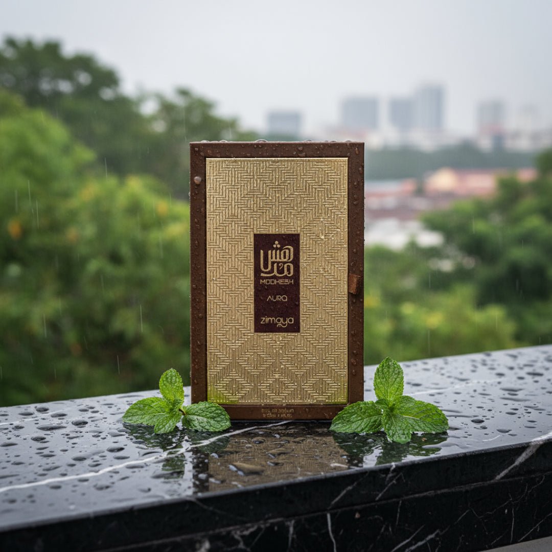 Men’s oriental woody perfume bottle on rain-wet black marble with mint leaves Malaysia – Modhesh Aura