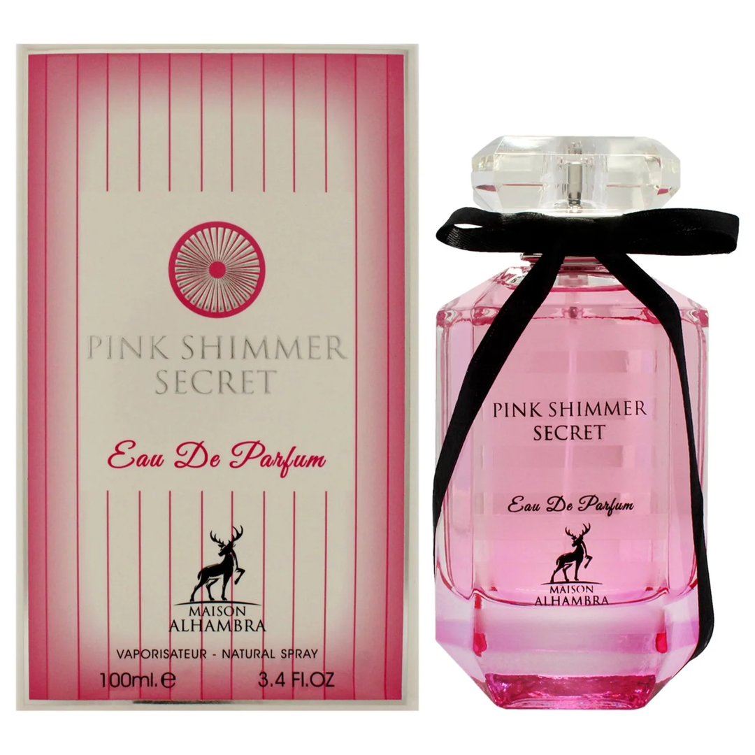 Maison Alhambra Pink Shimmer Secret 100ml — Pink perfume bottle with a black ribbon bow, next to its matching pink striped box, on a white background. | Maison Alhambra Pink Shimmer Secret 100ml — Botol minyak wangi merah jambu dengan reben hitam, bersebelahan kotak berjalur merah jambu yang sepadan, di atas latar
