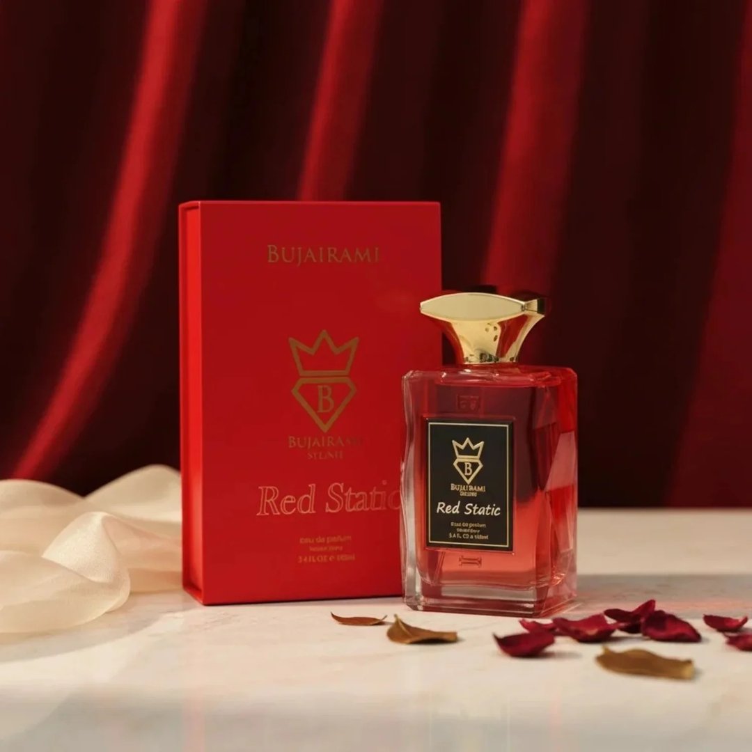 Bujairami Red Static — Red perfume bottle with gold cap next to matching red box with gold logo