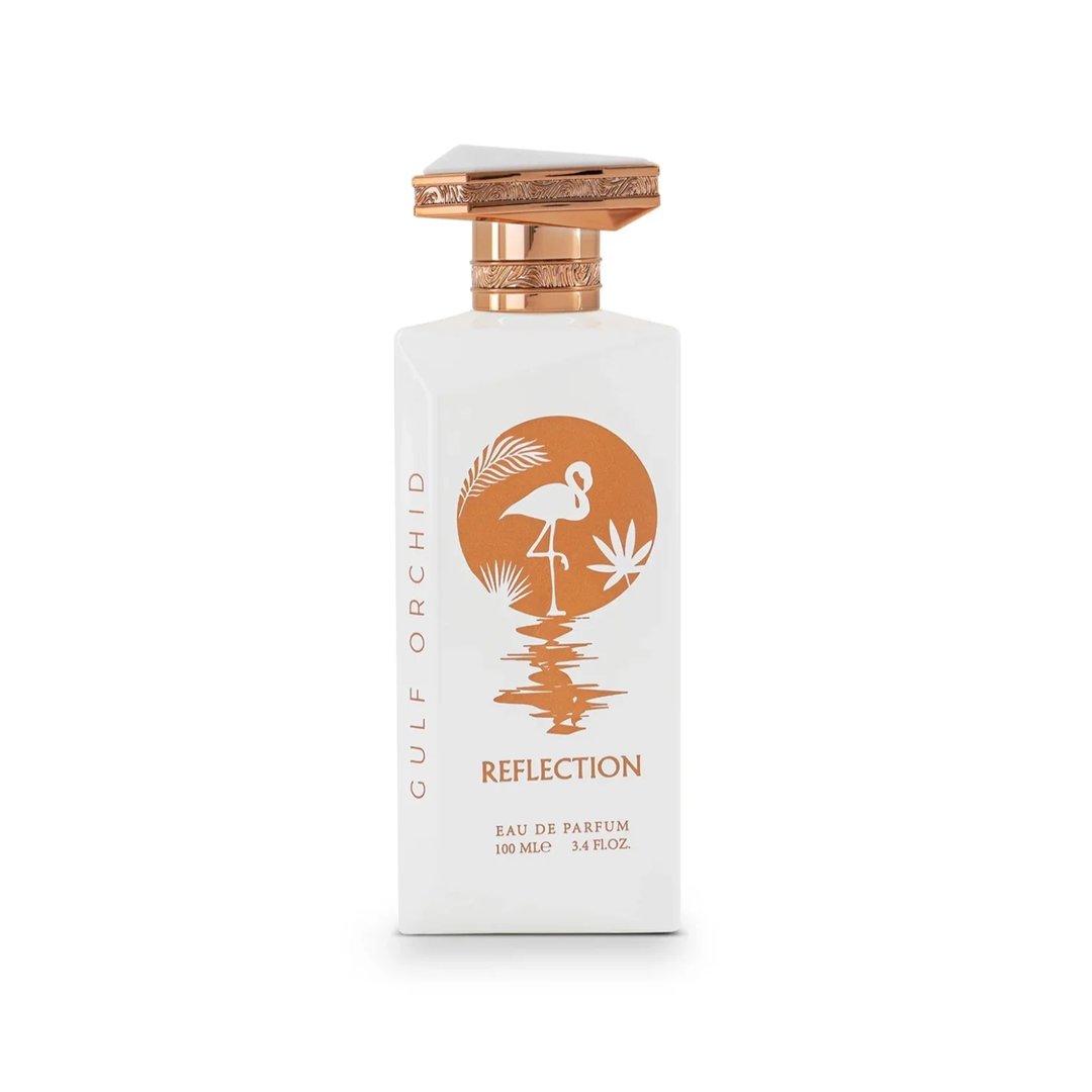 Gulf Orchid Reflection For Her 100ml by Gulf Orchid — White perfume bottle and its box, both featuring an orange circle with a flamingo and palm leaves design. | Gulf Orchid Reflection For Her 100ml by Gulf Orchid — Botol minyak wangi putih dan kotaknya, kedua-duanya menampilkan bulatan oren dengan reka bentuk