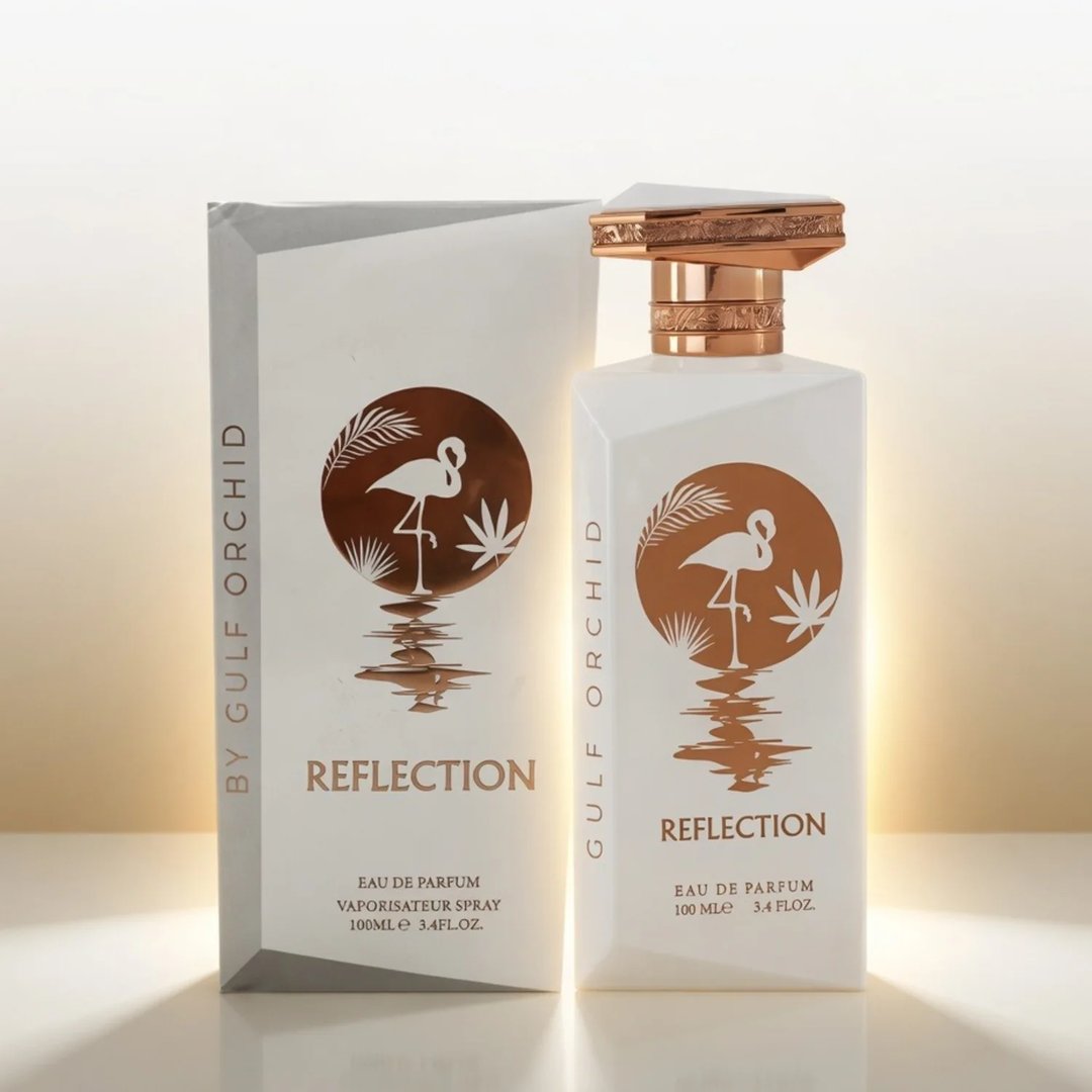 Gulf Orchid Reflection For Her 100ml by Gulf Orchid — White perfume bottle and its box, both featuring an orange circle with a flamingo and palm leaves design. | Gulf Orchid Reflection For Her 100ml by Gulf Orchid — Botol minyak wangi putih dan kotaknya, kedua-duanya menampilkan bulatan oren dengan reka bentuk