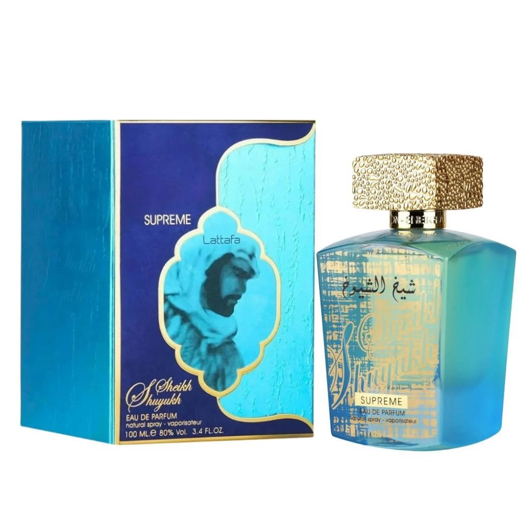 Lattafa Sheikh Al Shuyukh Supreme by Lattafa 100ml — A blue and green faceted glass perfume bottle with a gold textured cap sits next to its blue and light blue patterned box, which features an image of a man in traditional headwear. | Lattafa Sheikh Al Shuyukh Supreme by Lattafa 100ml — Botol kaca berfaset biru dan