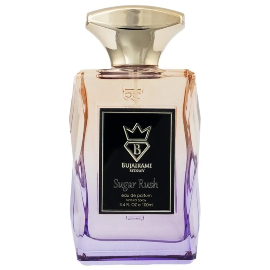 Bujairami Sugar Rush Eau de Parfum — Glass bottle with gold cap and gradient pink-blue liquid next to matching box.