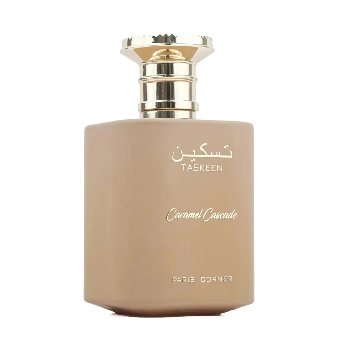 Paris Corner Taskeen Caramel Cascade 100ml — A rectangular perfume box with a marble-like pattern in beige and pink hues, accented with gold glitter stripes and gold text. | Paris Corner Taskeen Caramel Cascade 100ml — Peti minyak wangi berbentuk segi empat dengan corak seperti marmar dalam warna beige dan merah