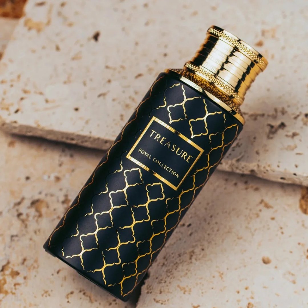 Maison Asrar Treasure by Maison Asrar 100ml EDP Unisex — Black bottle with gold geometric pattern and gold ornate cap, featuring a gold label with 'TREASURE ROYAL COLLECTION' text.
