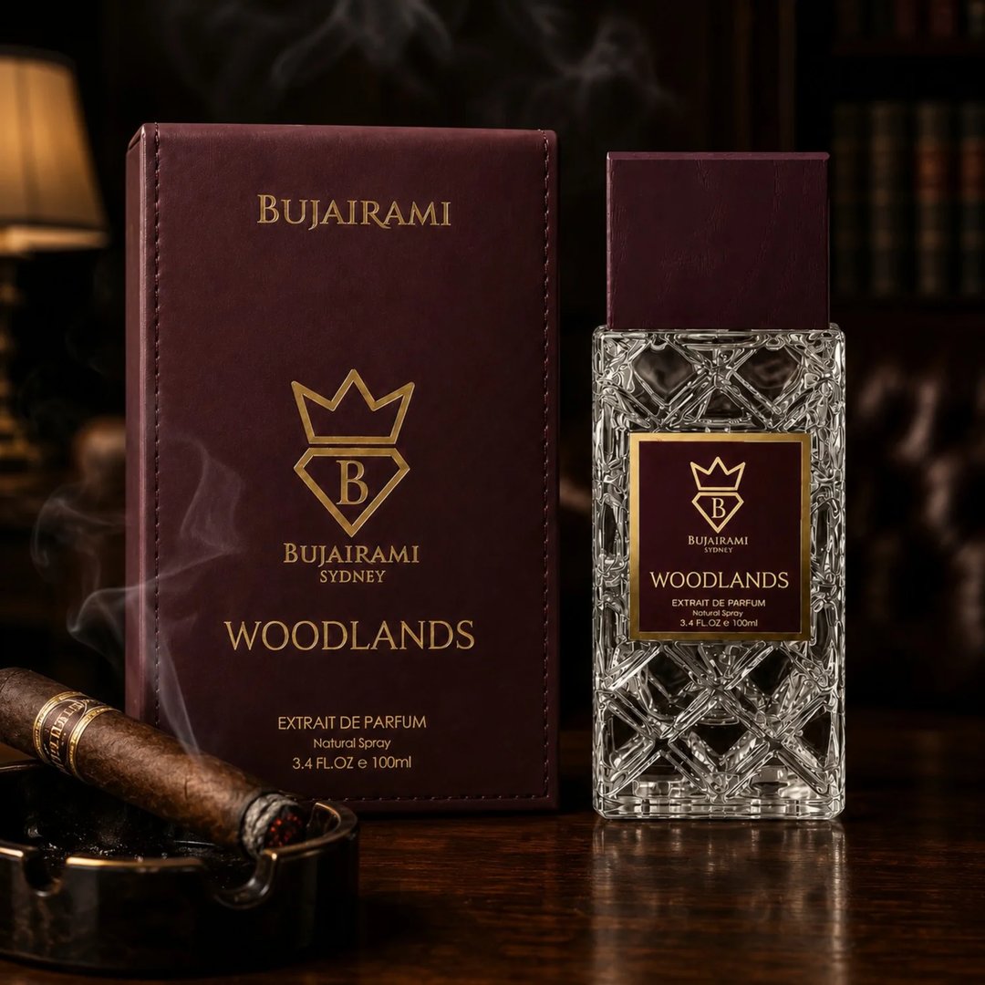 Bujairami Woodlands — Maroon box and faceted glass perfume bottle with gold accents and logo