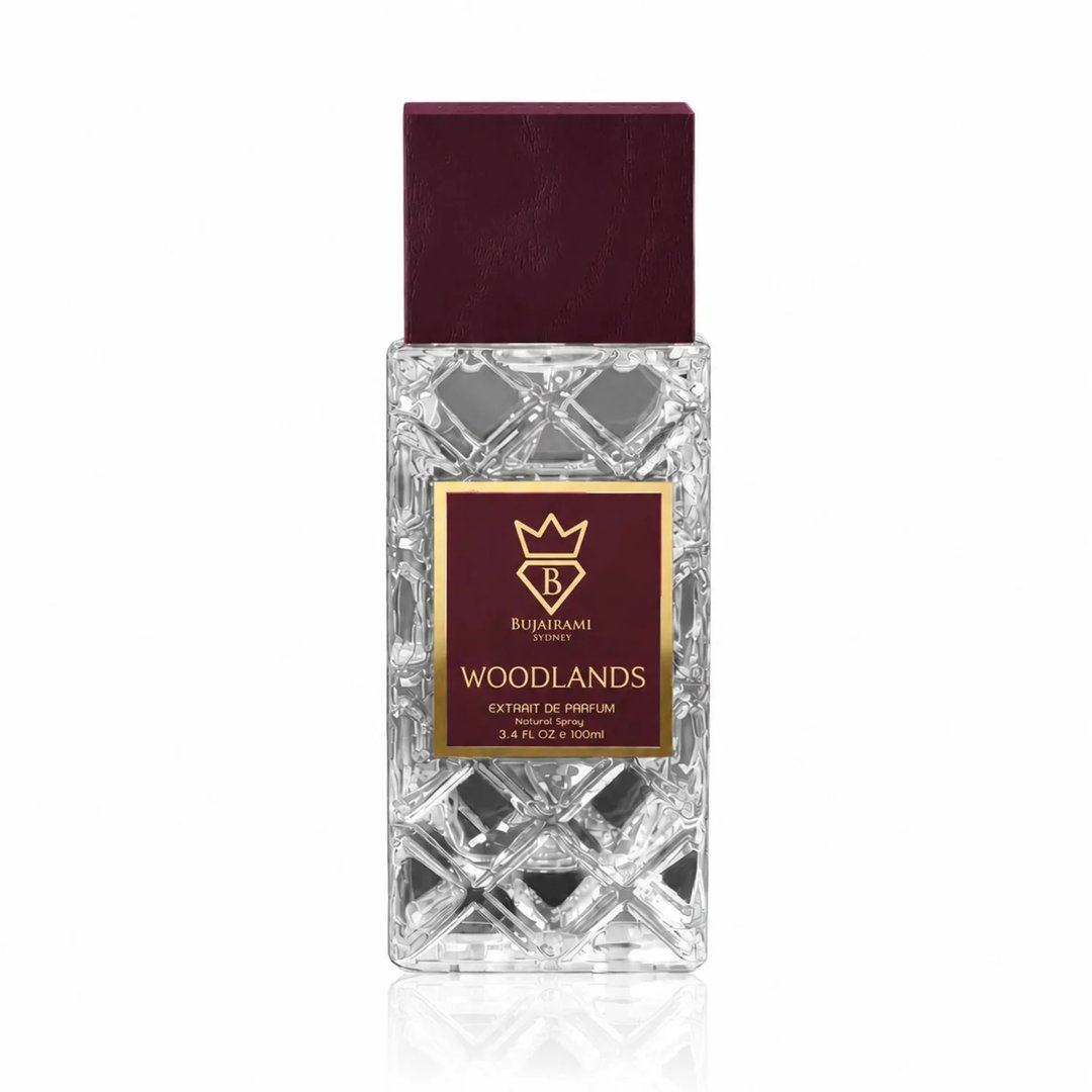 Bujairami Woodlands — Maroon box and faceted glass perfume bottle with gold accents and logo