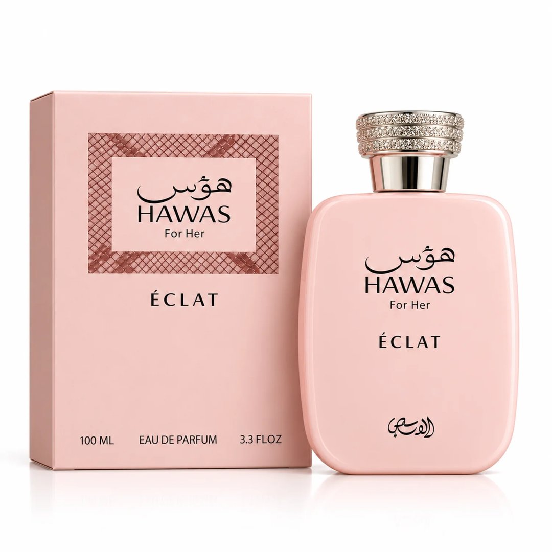 RASASI Hawas Eclat by Rasasi 100ml EDP — Pink perfume box and bottle with Arabic script and 'For Her' text, featuring a textured pattern on the box and a crystal-embellished cap on the bottle.