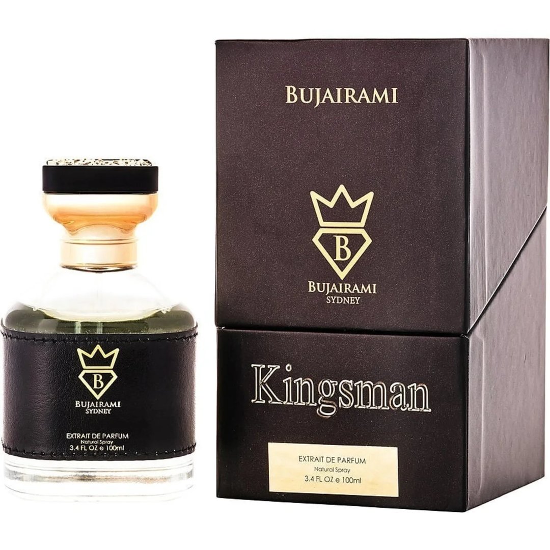 Bujairami Kingsman — A clear glass perfume bottle with a black leather band and gold accents sits next to its dark brown