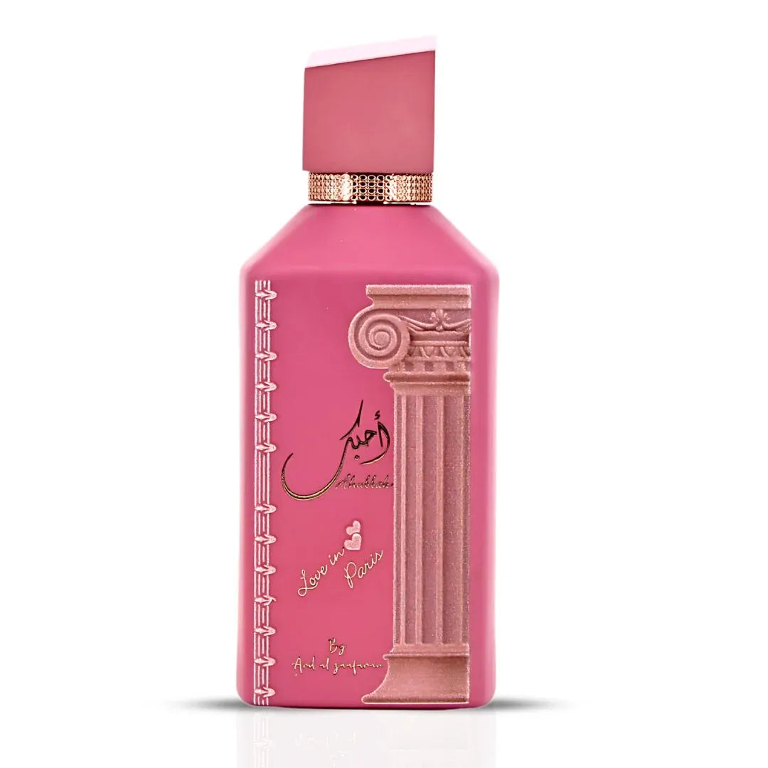 Ard Al Zaafaran Ahubbak Love In Paris EDP 100ml Zaafaran — Pink perfume bottle with a decorative column motif and gold accents, featuring Arabic script and "Love in Paris" text.
