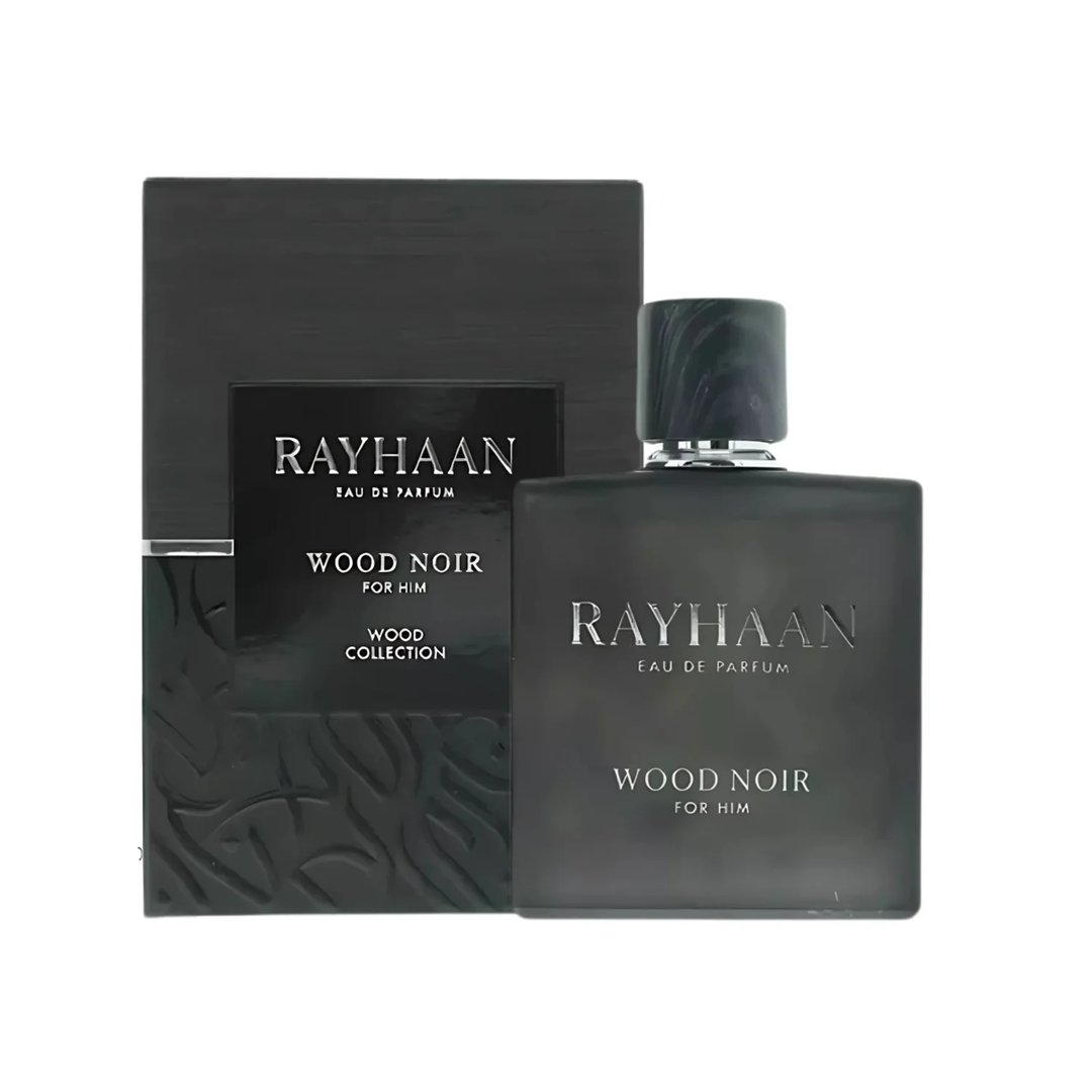 Rayhaan Woody Noir Eau De Parfum — A dark grey bottle of Rayhaan Woody Noir Eau De Parfum for him sits next to its matching dark grey box with embossed wood grain texture. | Rayhaan Woody Noir Eau De Parfum — Botol Rayhaan Woody Noir Eau De Parfum kelabu gelap untuk lelaki terletak di sebelah kotak kelabu gelap yang